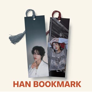May include: Two rectangular bookmarks featuring images of a person. One bookmark has a gray tassel and a dark gray top, the other has a maroon loop. The text "HAN BOOKMARK" is printed in red at the bottom.