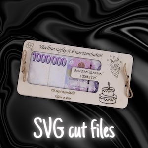 May include: A wooden box with a cut-out window displaying a stack of Czech Koruna banknotes. The box has a birthday cake design and the text "Všechno nejlepší k narozeninám!" (Happy Birthday!) and "1000.000 MILION KORUN ČESKÝCH" (One Million Czech Crowns).