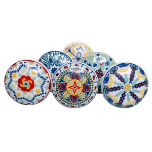 May include: Six ceramic cabinet knobs with colourful, intricate patterns. The knobs feature blue, yellow, red, and green designs.