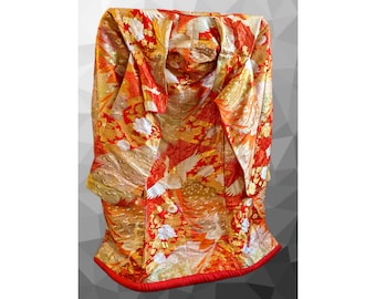 May include: A red and gold Japanese kimono with a crane pattern. The kimono is made of silk and has a traditional design.