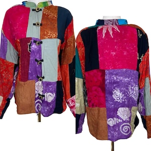 May include: A patchwork jacket with a mandarin collar and wooden toggle closures. The jacket features a vibrant mix of colors and patterns, including pink, purple, orange, and blue. The back of the jacket has a sun design.