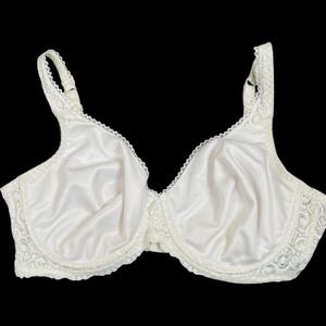 May include: A white bra with a satin finish and lace trim. The bra has adjustable straps and a classic design. The cups are smooth and the underbust band is also white.