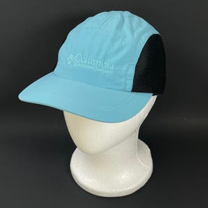 Gorra unisex de malla de 5 paneles de la colección Vintage Columbia Sportswear, color azul y negro, transpirable.