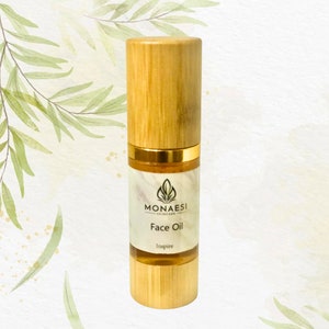 May include: A bamboo bottle with a gold lid and label that reads "MONAESI SKINCARE Face Oil Inspire".