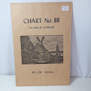 May include: A vintage cross-stitch chart titled "Chart No. 88 The Mill By A Stream." The cover is a light brown colour and features a black and white image of a windmill and a house. The chart measures 80 x 120 stitches.