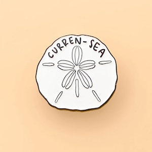 Sand Dollar Pin – Coastal Inspired Enamel Brooch for Beach Lovers, Nautical Jewelry Accessory, Handcrafted Ocean-Inspired Fashion Statement