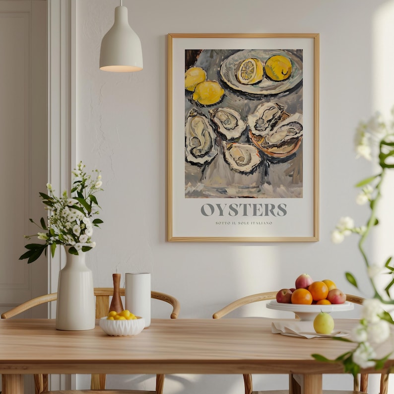 May include: A framed poster with a painting of oysters and lemons on a white background. The poster has the text "OYSTERS" and "MOTTO IL SOLE ITALIANO" in grey lettering.