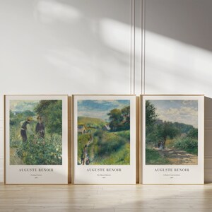 May include: Three framed art prints of paintings by Auguste Renoir. The first print shows two people in a garden, the second print shows a path leading through a green landscape, and the third print shows a path leading through a forest.
