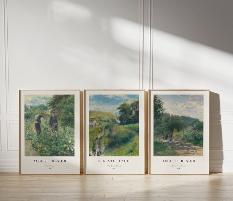 May include: Three framed art prints of paintings by Auguste Renoir. The first print shows two people in a garden, the second print shows a path leading through a green landscape, and the third print shows a path leading through a forest.