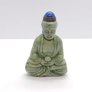 China. Minguo period. 1920 circa. Handcarved hardstone snuff bottle ina GuanYin Buddha. Extremely fine.