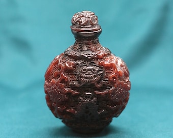 Chinese Snuff Bottle. Min Guo period. China 1920 circa.  Fully encarved red lacquer snuff bottle.