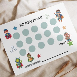 Könnte beinhalten: Eine weiße Belohnungstafel mit Comic-Superhelden, Sternen und dem deutschen Text "Ich schaffe das!". Die Tafel hat 15 hellblaue Kreise für Aufkleber und eine Linie für eine Belohnung. Das Design ist für Kinder.