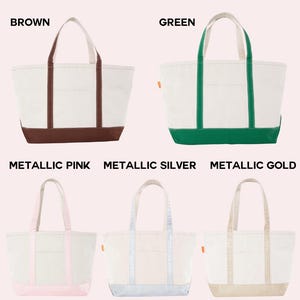 May include: Five canvas tote bags arranged in two rows. The top row features brown and green bags. The bottom row shows metallic pink, metallic silver, and metallic gold bags. Each bag has a white body, colored base, and matching handles.