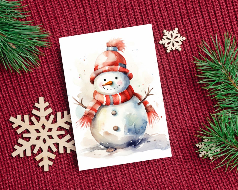 Puede incluir: Una pintura de acuarela de un mu&ntilde;eco de nieve con un sombrero y una bufanda rojos y blancos. El mu&ntilde;eco de nieve est&aacute; de pie sobre un fondo blanco con un cielo azul claro.