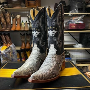 May include: A set of three ceramic mugs with a speckled, matte finish. The mugs are in shades of cream, light gray, and dark gray. Each mug has a simple, minimalist design, perfect for coffee or tea.