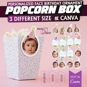 May include: A personalised popcorn box birthday ornament with a white background and colourful sprinkles. The box has a space for a photo and the text "DRAG AND DROP" is visible. The ornament is available in three different sizes and can be edited in Canva.