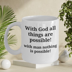 May include: White ceramic mug with black text that reads "With God all things are possible! with man nothing is possible!"