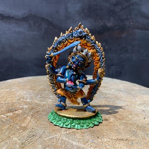 Fine quality colorful four armed mahakala statue. gompo chyag shipa. mahakala in blazing fire.