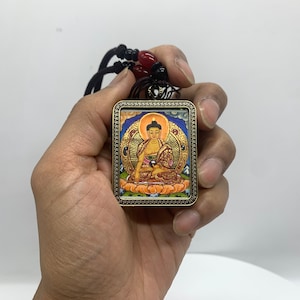 Shakyamuni buddha pendant thangka. thangka painting. hand painted siddhartha gautam buddha. protection amulet. ghau box.