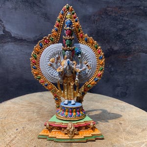 fine quality thousand armed avalokitesvara statue. gold plated compassion buddha. colorful chenrezig statue. filled with required mantras.