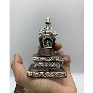 Lotus stupa with tibetan box. One among 8 great stupas. Stupa representing the Buddha&#39;s birth.