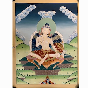 May include: A detailed painting of a seated figure with a green halo, adorned with jewelry and a patterned skirt. The background features a blue sky with cloud formations and rolling green hills. The artwork is framed.