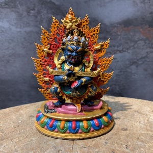 two armed mahakala statue. gompo ghur. prajana mahakala. Handcrafted colorful shakyapa mahakala statue. Dharma protector.