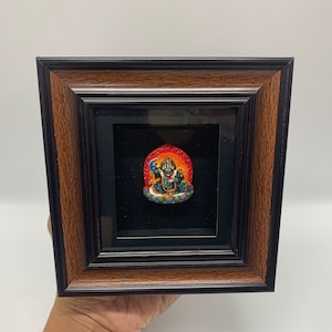 4 cm colorful mahakala bernagchen tsatsa. handmade clay statue with frame. filled with extremely rare blessing items. made by kagyu monks.