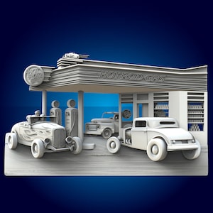 May include: A vintage petrol station with the sign "HOTROD-GAS" above the entrance. There are three cars in front of the station, including a red hot rod with flames on the side, a white pickup truck, and a white hot rod.