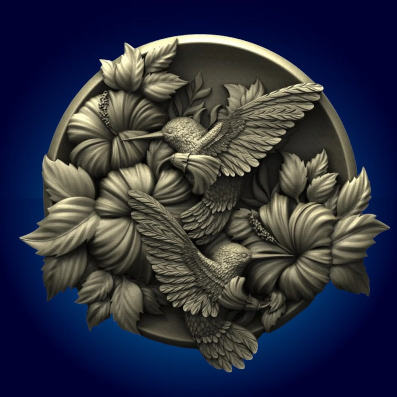 May include: A 3D relief carving of two hummingbirds in flight, surrounded by hibiscus flowers. The carving is done in a light gray color and has a textured surface.
