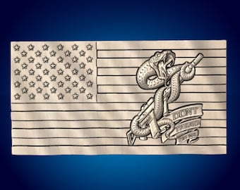 May include: A wood carving of an American flag with a snake wrapped around a rifle. The snake is biting the rifle and the text "Don't Tread On Me" is on a banner below the snake.