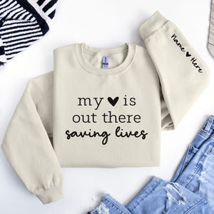 My Heart is Out There Saving Lives - Custom Sleeve Sweatshirt for EMT, Paramedic, Firefighter, First Responder, Police Officer