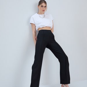 Linen pants with stitch detail. Linen trousers with stitching on the front and pockets. Provides comfort with hidden zipper on the side.