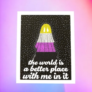May include: A black and white print with a stylized ghost figure in the center. The ghost is made up of yellow, white, purple, and black dots. The ghost has two yellow teardrop shapes on top. The text "the world is a better place with me in it" is below the ghost.