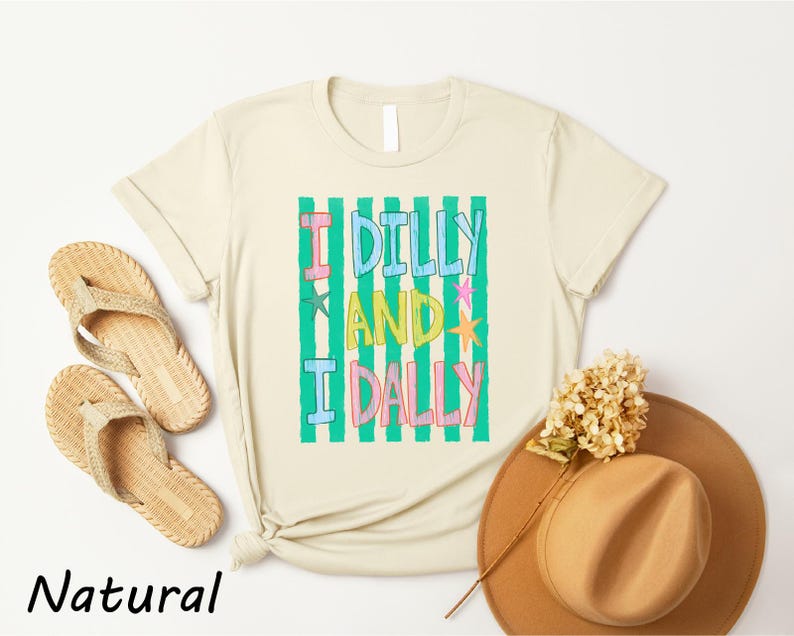 a casual outfit consisting of a beige t-shirt with a colorful graphic, a pair of beige flip-flops, a brown hat, and a dried flower.