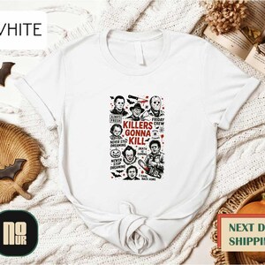 May include: White t-shirt featuring a graphic design with the text "Killers Gonna Kill" and illustrations of horror movie characters. The shirt has a classic crew neck and short sleeves, perfect for casual wear.