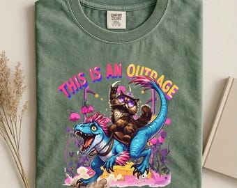 This is an Outrage T-Shirt, Princess Donut and Mongo Top, Dungeon Crawler Carl Shirt, Cat Lover Tshirt,Dinosaur Graphic Tee