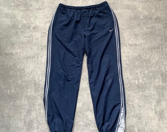 Nike tack panst herenjoggers met volledige ritssluiting N-atletische maat Large blauw marine jaren '80 y2k vintage streetstyle jaren '90 drill opium retro