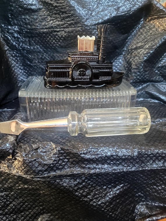 Set of two of vintage unique Avon after shave bott