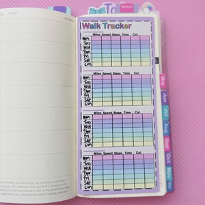 May include: A printable planner sticker with a pastel rainbow design. The sticker is labeled "Walk Tracker" and has columns for miles, speed, steps, time, and calories burned. The sticker is designed to be used in a planner or journal.