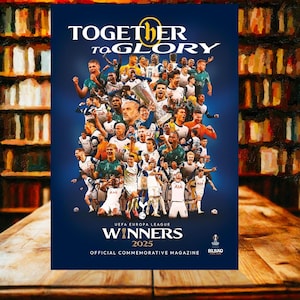 May include: A magazine cover with a dark blue background, featuring a collage of soccer players in white and navy uniforms, celebrating with a trophy. The text reads "TOGETHER TO GLORY" and "WINNERS 2025". The magazine is an official commemorative edition.