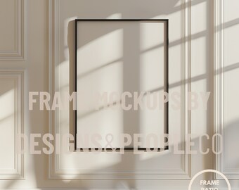 May include: A black picture frame mockup on a white wall with a textured pattern. The frame is empty and has a thin black border. The wall is decorated with white molding. The text "FRAME MOCKUPS BY DESIGNS & PEOPLE CO" is visible in the image. The text "FRAME RATIO DIN A/ISO" is visible in a circle in the lower right corner of the image.