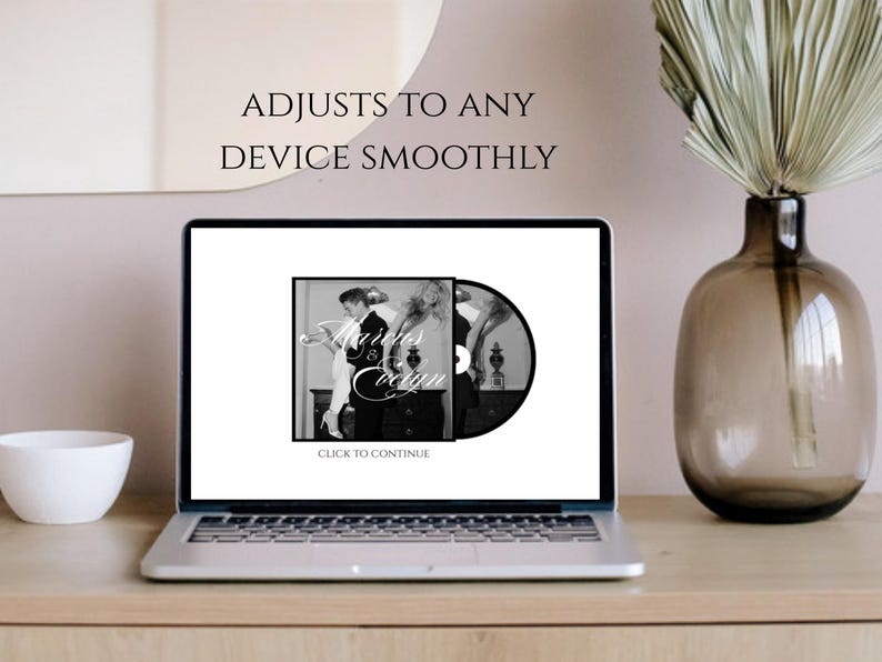 May include: A silver laptop displays a black and white image with the text "Adjusts to any device smoothly." The image on the screen features a vintage photograph with the words "Marries & Coogan." A white bowl and a decorative vase are on the wooden surface.