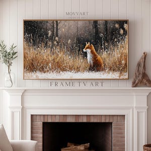 Puede incluir: Una obra de arte enmarcada que representa un zorro en un campo nevado. La obra está en un marco dorado y cuelga sobre una chimenea. Los textos "MOVART" y "FRAME TV ART" son visibles.