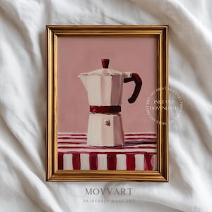 May include: A framed print of a white and red stovetop espresso maker. The painting has a pink background and a red and white striped tablecloth. The frame is gold. The print is labeled "MOVART PRINTABLE WALL ART".