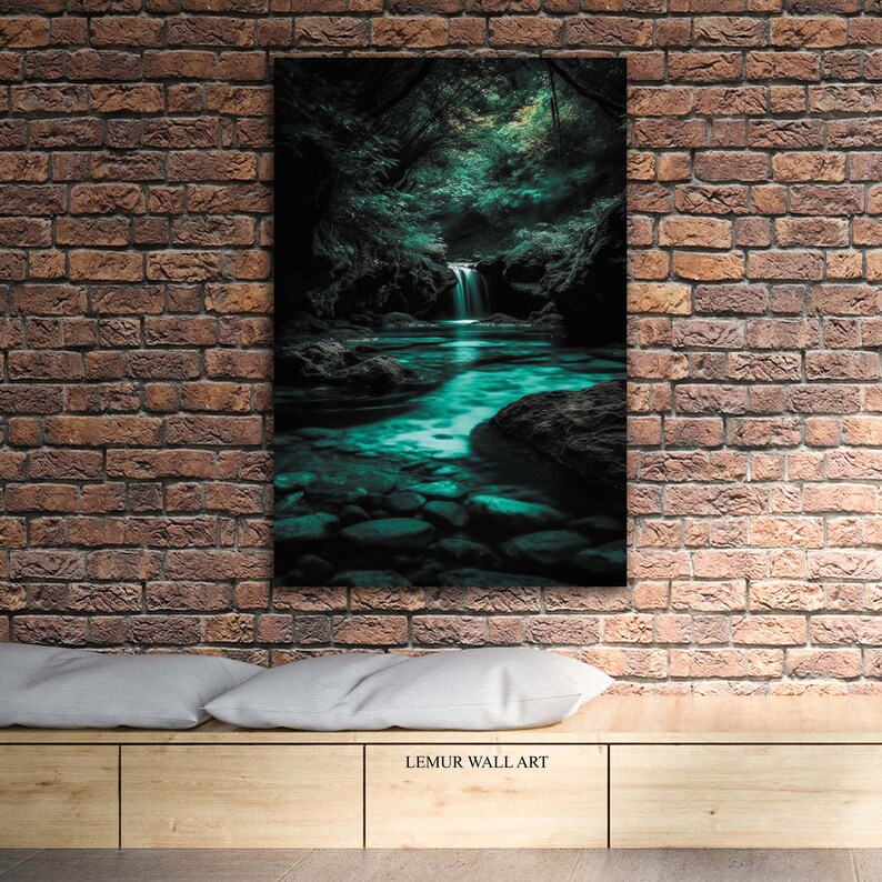 May include: A canvas wall art print depicting a serene forest scene with a waterfall cascading into a turquoise-colored stream. The artwork features lush green foliage and dark shadows, creating a tranquil and natural ambiance. The text "LEMUR WALL ART" is at the bottom.