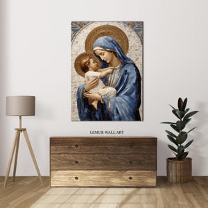 May include: A mosaic wall art print depicting the Virgin Mary holding a baby Jesus. The artwork features a blue and gold color scheme with a detailed mosaic pattern.