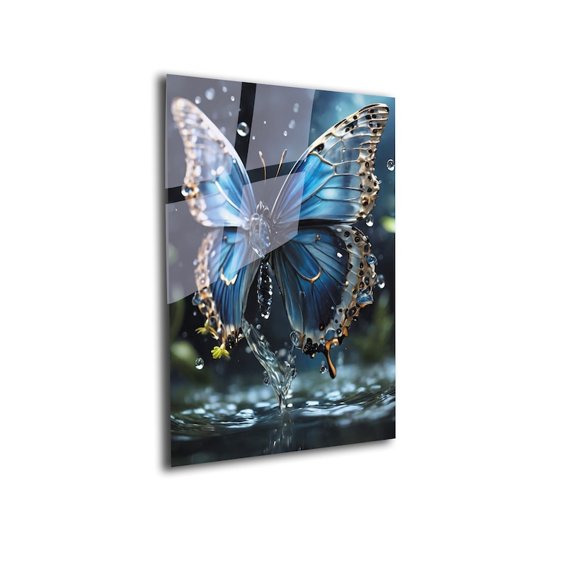 May include: A blue butterfly with gold accents is perched on a water droplet, creating a splash. The butterfly's wings are spread wide, and the water droplets are scattered around it.