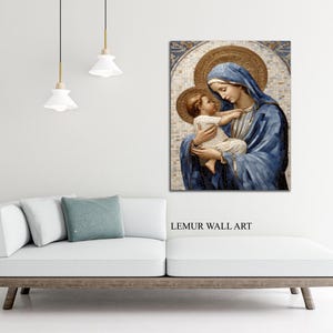 May include: A painting of the Virgin Mary holding a baby Jesus. The painting is done in a mosaic style with gold and blue tones. The painting is framed and hanging on a white wall.