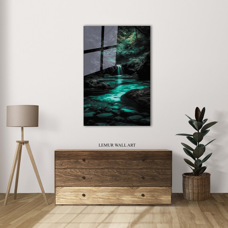 May include: A framed wall art print depicting a serene waterfall scene with turquoise water and lush greenery. The artwork is displayed above a wooden dresser. The text "LEMUR WALL ART" is visible at the bottom of the print.